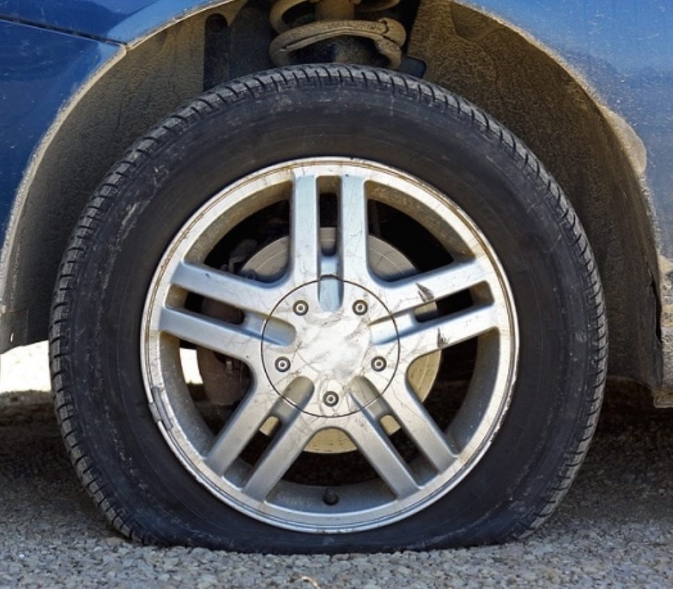 Flat tire on a passenger car